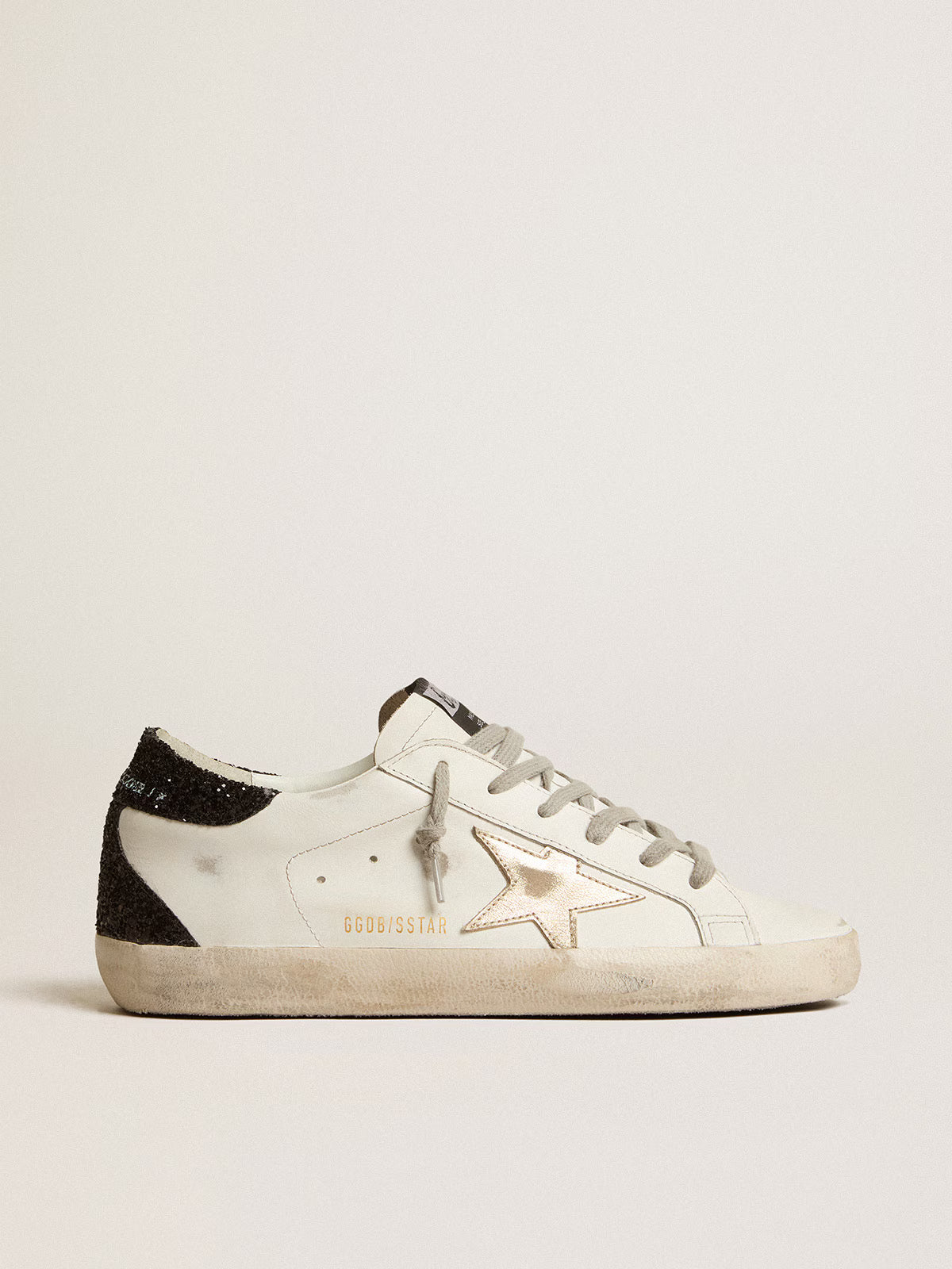 Super-Star avec étoile dorée et contrefort à paillettes noires